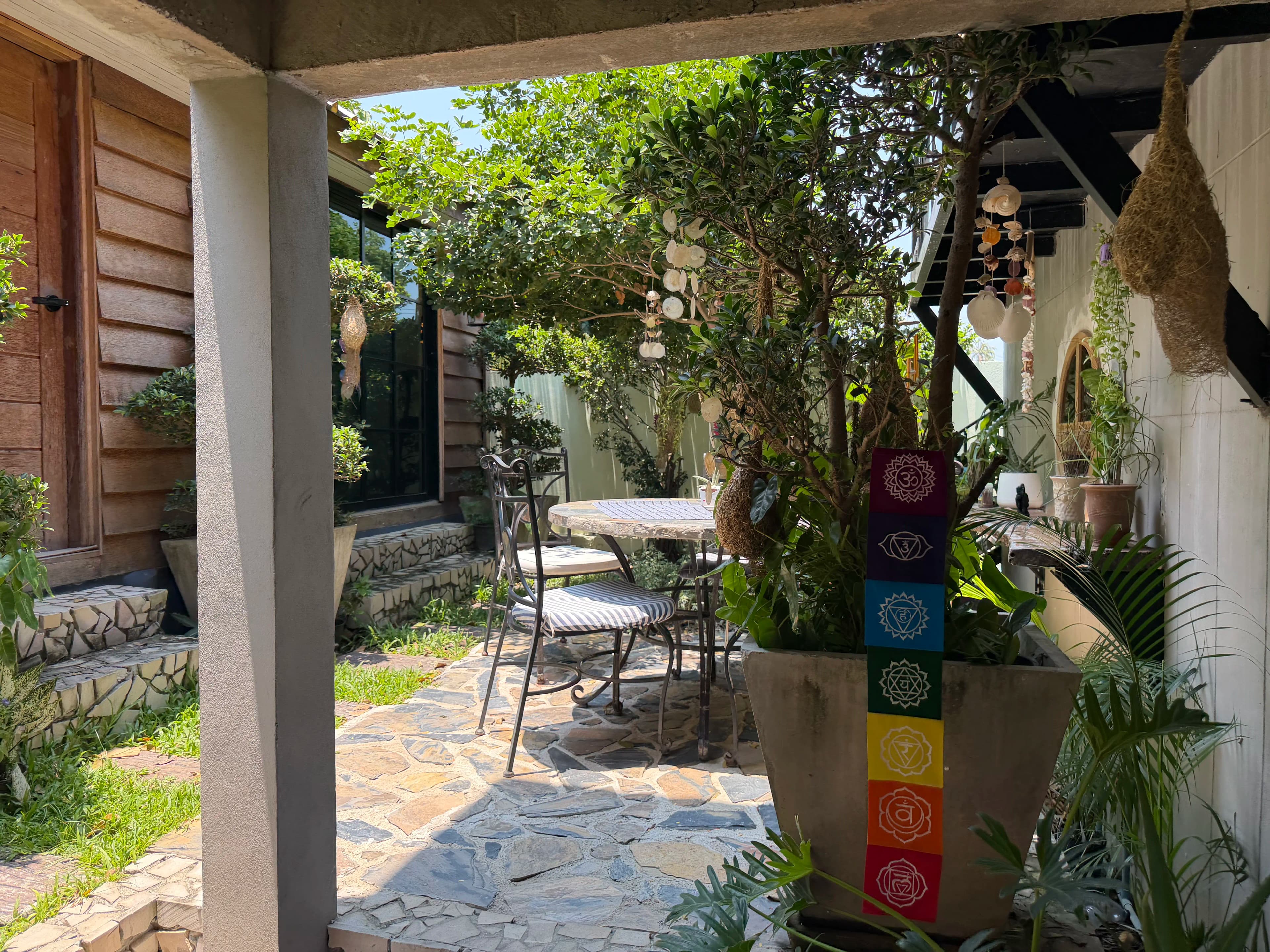The garden patio seating area at Zen Pod