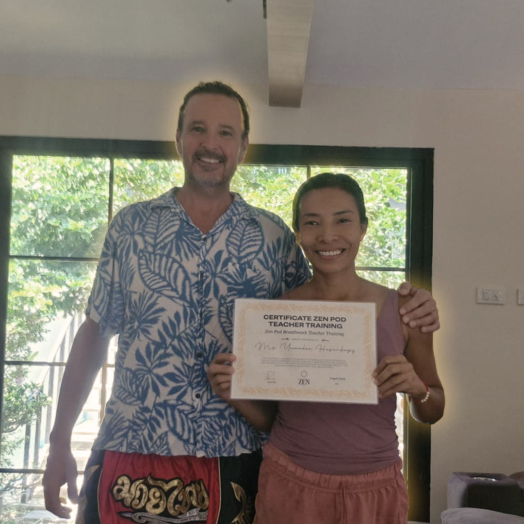 A newly certified Zen Pod breathwork graduate with their certificate